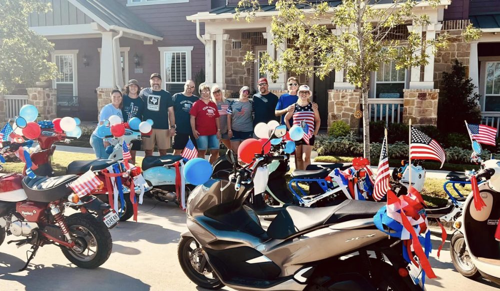 neighbors with scooters decorated in red, white and blue