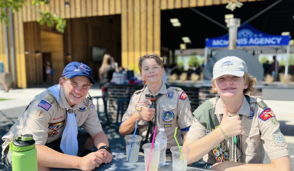 3 Boy Scouts having lemonade