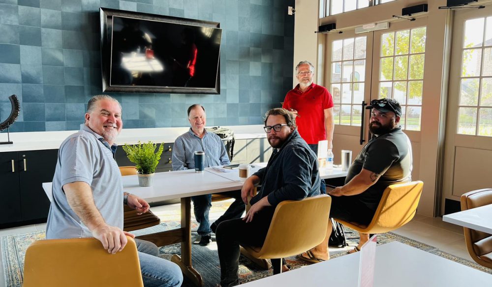group of men in a meeting room