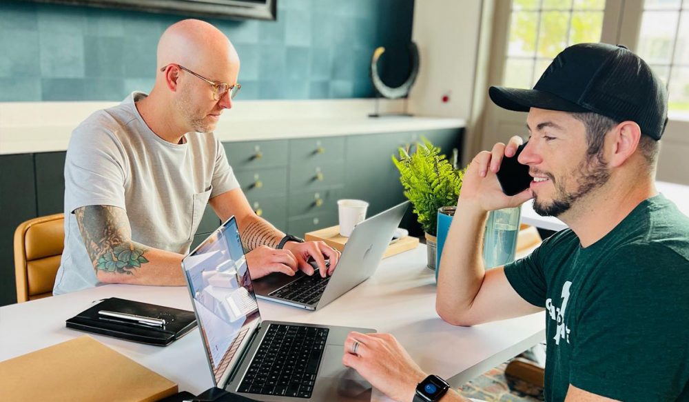 2 men in meeting room working