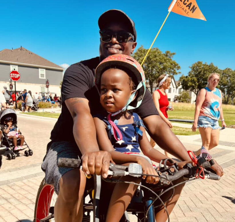father and son riding a bike